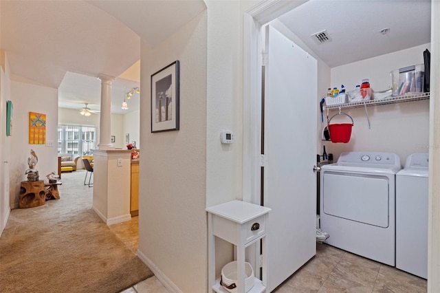 200 4th Ave S Unit 220, Saint Petersburg, FL 33701 - laundry room featuring decorative columns, washing machine and clothes dryer, light carpet, and ceiling fan