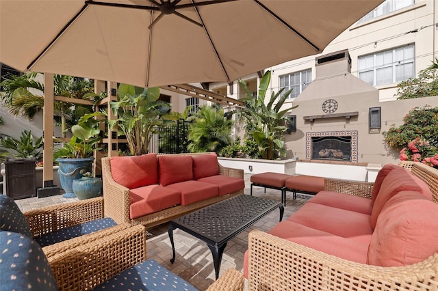 200 4th Ave S Unit 220, Saint Petersburg, FL 33701 - view of patio featuring an outdoor living space with a fireplace