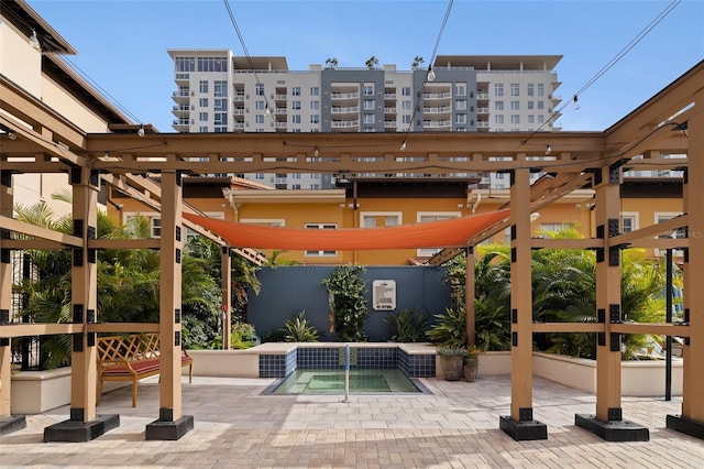 200 4th Ave S Unit 220, Saint Petersburg, FL 33701 - view of patio / terrace featuring a hot tub and a pergola