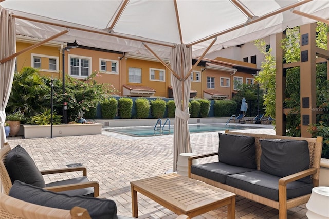 200 4th Ave S Unit 220, Saint Petersburg, FL 33701 - community pool with outdoor lounge area and a patio