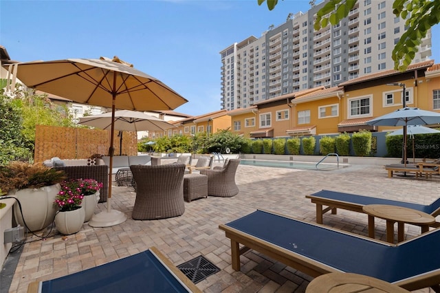 200 4th Ave S Unit 220, Saint Petersburg, FL 33701 - view of patio / terrace with an outdoor living space and a community pool