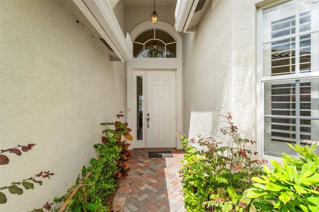 5009 Sandy Brook Cir, Wimauma, FL 33598 - view of exterior entry featuring stucco siding