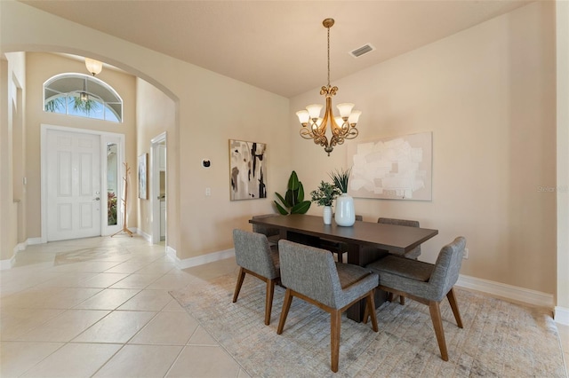 5009 Sandy Brook Cir, Wimauma, FL 33598 - dining room with arched walkways, a chandelier, and light tile patterned flooring