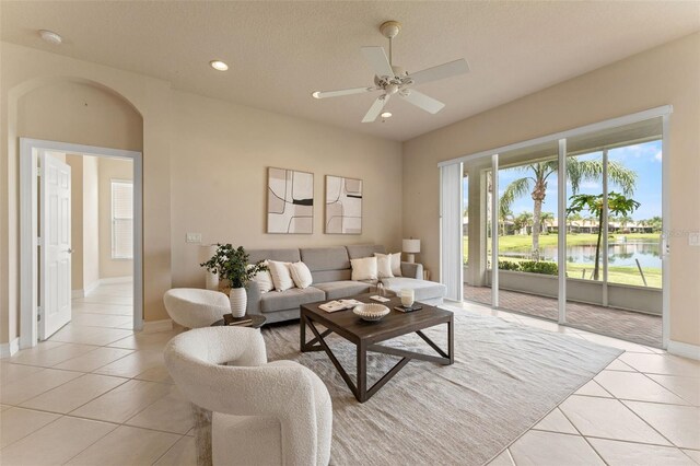 5009 Sandy Brook Cir, Wimauma, FL 33598 - living room with light tile patterned flooring, recessed lighting, a water view, and ceiling fan