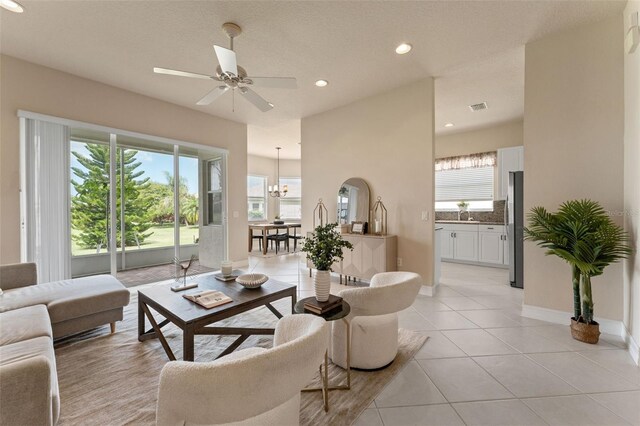 5009 Sandy Brook Cir, Wimauma, FL 33598 - living area with healthy amount of natural light, ceiling fan, light tile patterned flooring, and recessed lighting