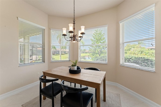 5009 Sandy Brook Cir, Wimauma, FL 33598 - dining room featuring a chandelier and light tile patterned flooring