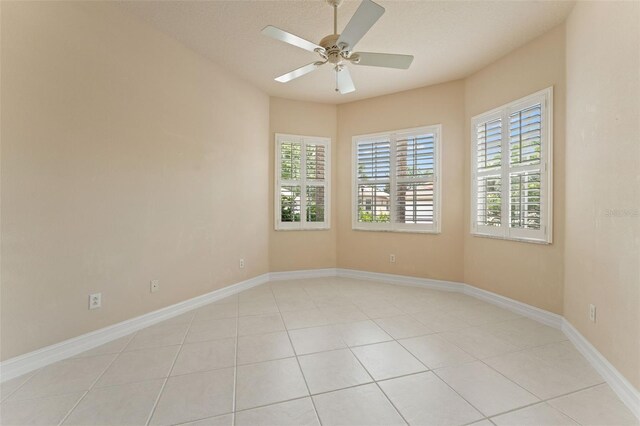 5009 Sandy Brook Cir, Wimauma, FL 33598 - unfurnished room with healthy amount of natural light, ceiling fan, and light tile patterned flooring