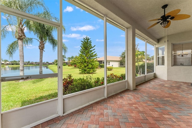 5009 Sandy Brook Cir, Wimauma, FL 33598 - unfurnished sunroom featuring a water view and a ceiling fan