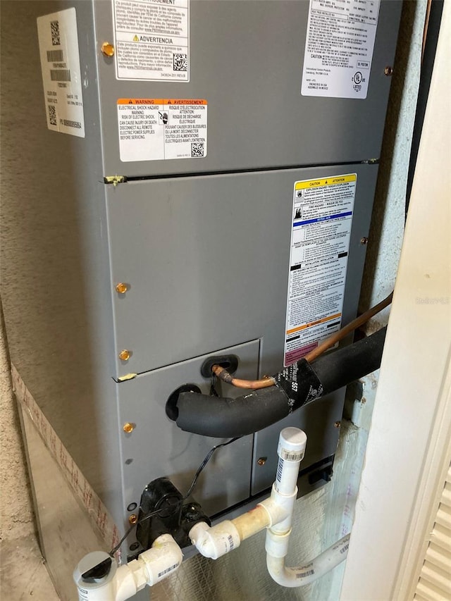 utility room with heating unit