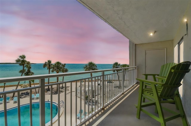 200 1st Ave Unit 309, St Pete Beach, FL 33706 - balcony with a water view and view of pool