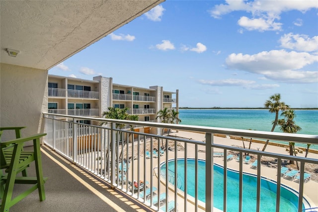 200 1st Ave Unit 309, St Pete Beach, FL 33706 - balcony featuring a water view and view of pool