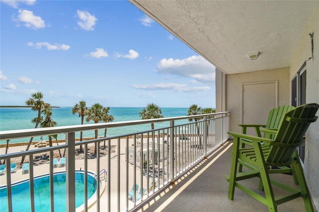 200 1st Ave Unit 309, St Pete Beach, FL 33706 - balcony featuring a water view and view of pool