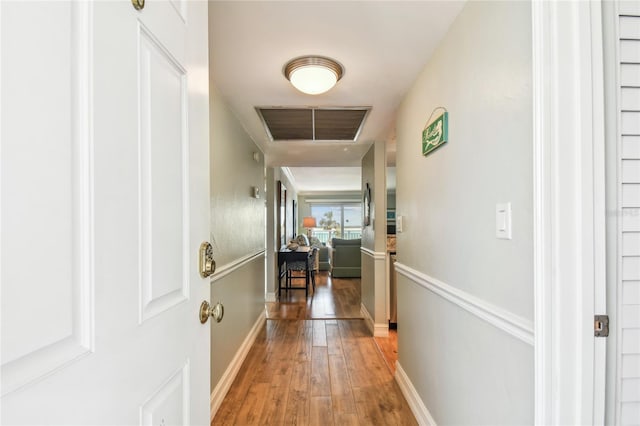 200 1st Ave Unit 309, St Pete Beach, FL 33706 - hall featuring wood-type flooring and baseboards