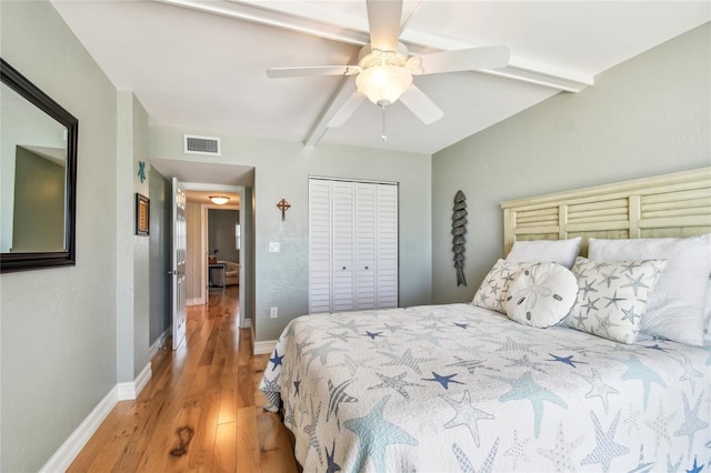 200 1st Ave Unit 309, St Pete Beach, FL 33706 - bedroom featuring light wood finished floors, a ceiling fan, baseboards, and a closet