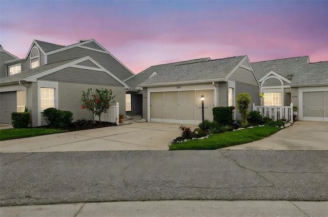 3520 51st Ave W, Bradenton, FL 34210 - view of front of house featuring concrete driveway, stucco siding, a garage, and a shingled roof