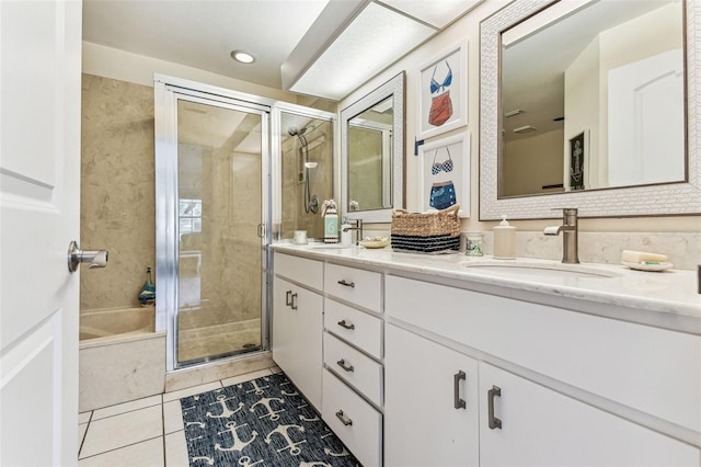 3520 51st Ave W, Bradenton, FL 34210 - full bathroom with a shower stall, double vanity, tile patterned floors, and a tub
