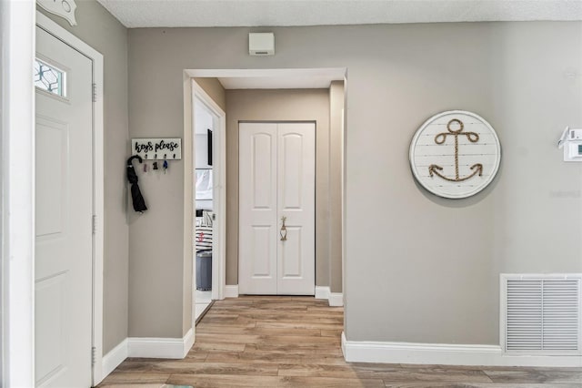 3520 51st Ave W, Bradenton, FL 34210 - hall featuring light wood-style flooring and baseboards