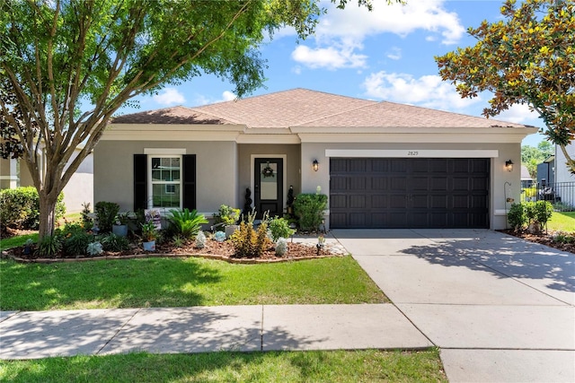 ranch-style house featuring stucco siding, an attached garage, concrete driveway, and a shingled roof