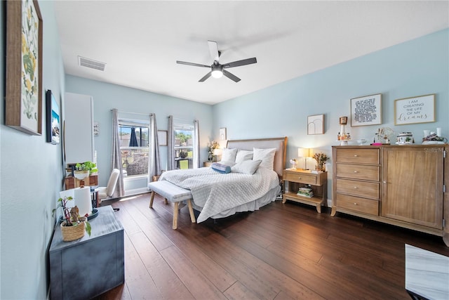 bedroom featuring dark wood-type flooring and a ceiling fan