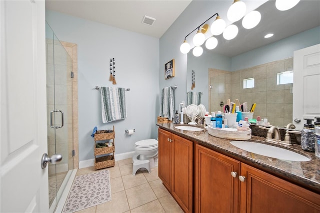 full bathroom featuring a shower stall, double vanity, toilet, tile patterned floors, and baseboards