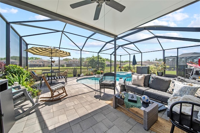 view of patio / terrace with an outdoor living space, ceiling fan, a pool with connected hot tub, and glass enclosure