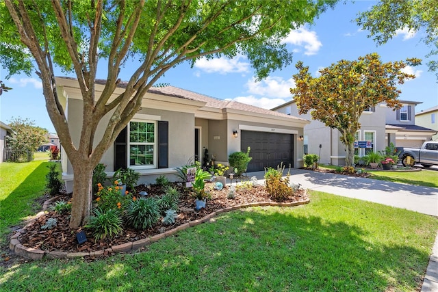 view of front facade with stucco siding, an attached garage, a front yard, and driveway