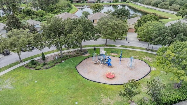 drone / aerial view of a recreational park and a nearby body of water