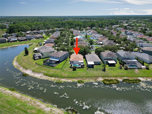 aerial perspective of suburban area with a nearby body of water