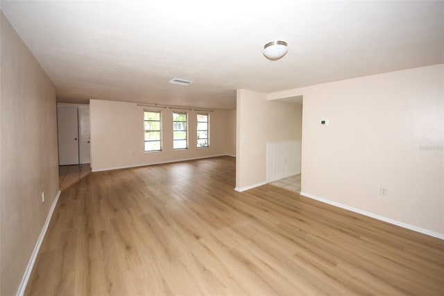 7904 Judith Cres, Port Richey, FL 34668 - spare room featuring light wood-style floors and baseboards