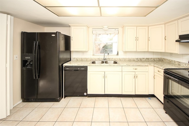 7904 Judith Cres, Port Richey, FL 34668 - kitchen with black appliances, a sink, under cabinet range hood, light tile patterned flooring, and light stone counters