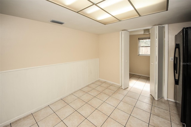 7904 Judith Cres, Port Richey, FL 34668 - unfurnished room with light tile patterned floors and baseboards