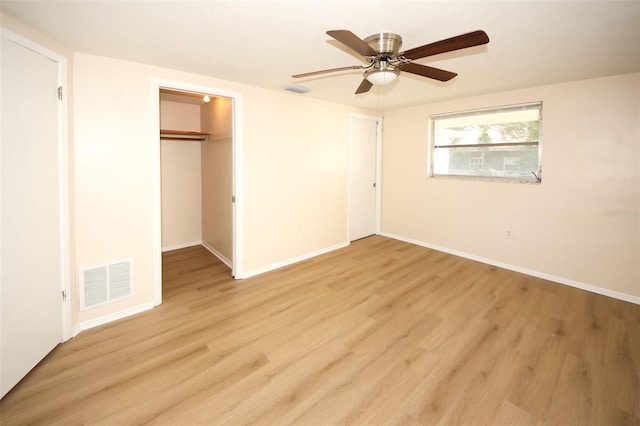 7904 Judith Cres, Port Richey, FL 34668 - unfurnished bedroom with light wood finished floors, baseboards, a ceiling fan, and a closet