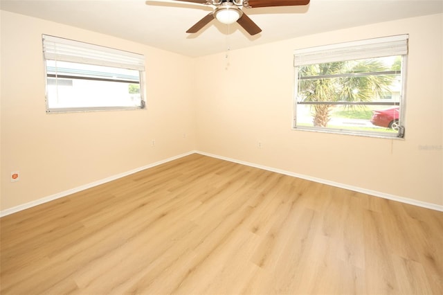 7904 Judith Cres, Port Richey, FL 34668 - unfurnished room featuring light wood-style flooring, baseboards, and a ceiling fan