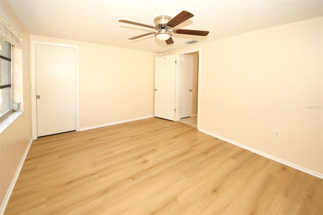 7904 Judith Cres, Port Richey, FL 34668 - empty room with light wood-style flooring, a ceiling fan, and baseboards