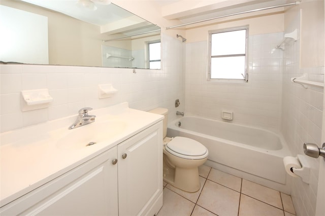 7904 Judith Cres, Port Richey, FL 34668 - bathroom with tile walls, shower / bath combination, toilet, vanity, and tile patterned flooring