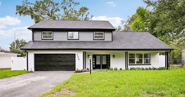 226 Willowick Ave, Temple Terrace, FL 33617 - view of front of house with an attached garage, driveway, roof with shingles, and brick siding