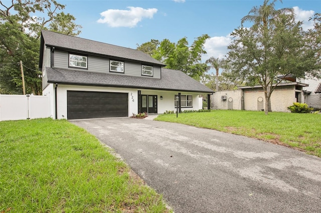 226 Willowick Ave, Temple Terrace, FL 33617 - view of front of home featuring asphalt driveway, an attached garage, and a shingled roof