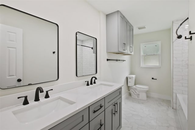 226 Willowick Ave, Temple Terrace, FL 33617 - bathroom featuring toilet, double vanity, shower / bath combination, and baseboards