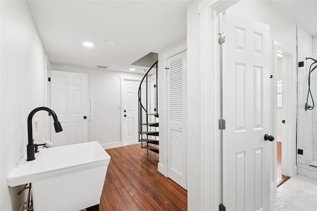 226 Willowick Ave, Temple Terrace, FL 33617 - hallway with a sink, stairs, recessed lighting, baseboards, and wood finished floors