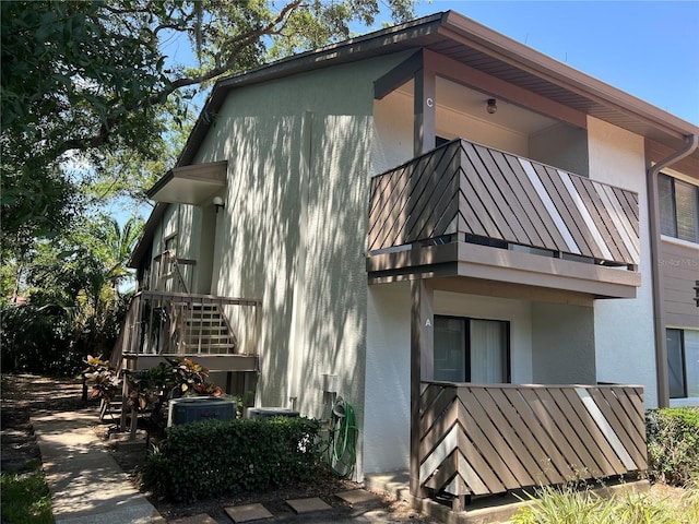 647 Fairmont Ave Unit C, Safety Harbor, FL 34695 - view of side of property featuring stucco siding and a balcony