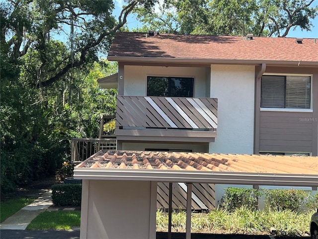 647 Fairmont Ave Unit C, Safety Harbor, FL 34695 - exterior view of stucco siding and a downspout