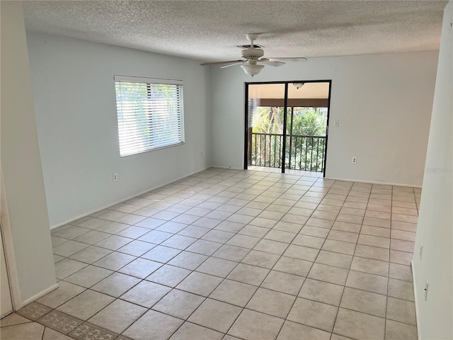 647 Fairmont Ave Unit C, Safety Harbor, FL 34695 - spare room with a textured ceiling, ceiling fan, and light tile patterned flooring