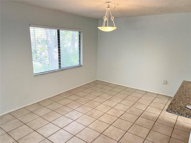 647 Fairmont Ave Unit C, Safety Harbor, FL 34695 - unfurnished dining area with light tile patterned floors