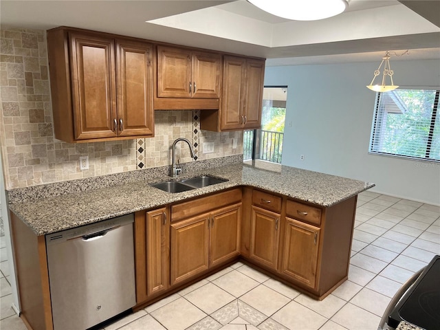 647 Fairmont Ave Unit C, Safety Harbor, FL 34695 - kitchen with dishwasher, a sink, plenty of natural light, and brown cabinets