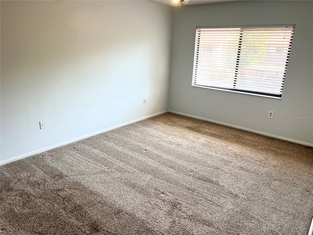 647 Fairmont Ave Unit C, Safety Harbor, FL 34695 - carpeted empty room with baseboards