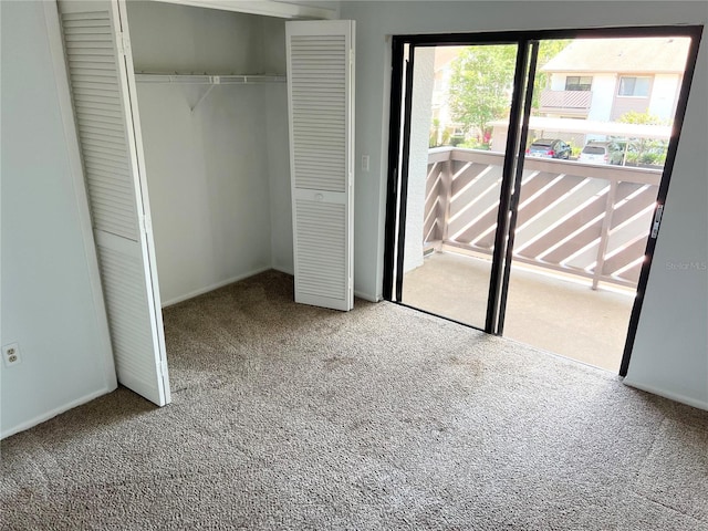 647 Fairmont Ave Unit C, Safety Harbor, FL 34695 - unfurnished bedroom featuring carpet flooring, a closet, and baseboards