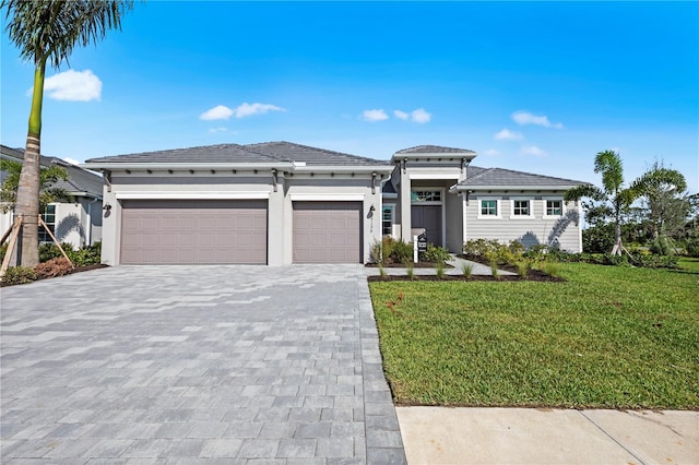 10447 New Brunswick St, Port Charlotte, FL 33981 - prairie-style home with a garage, decorative driveway, a front yard, and stucco siding