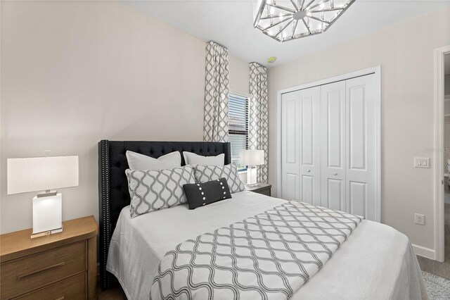 10447 New Brunswick St, Port Charlotte, FL 33981 - bedroom with a closet, a chandelier, and baseboards