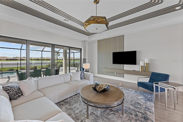 10447 New Brunswick St, Port Charlotte, FL 33981 - living area with a raised ceiling, healthy amount of natural light, and wood finished floors