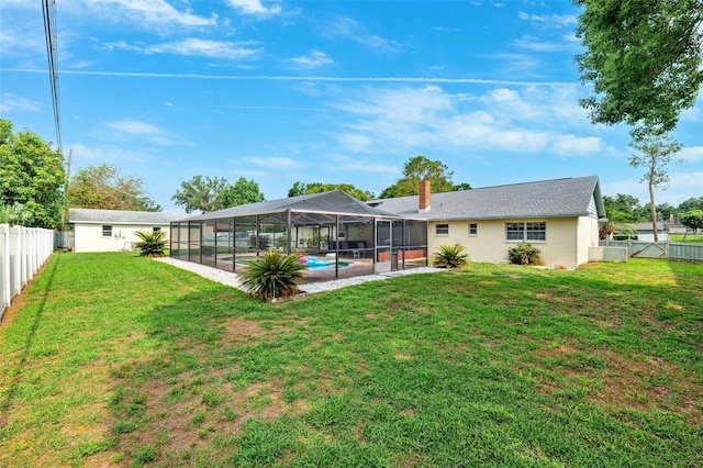 2013 Capri Rd, Valrico, FL 33594 - back of property with a chimney, a patio, and glass enclosure